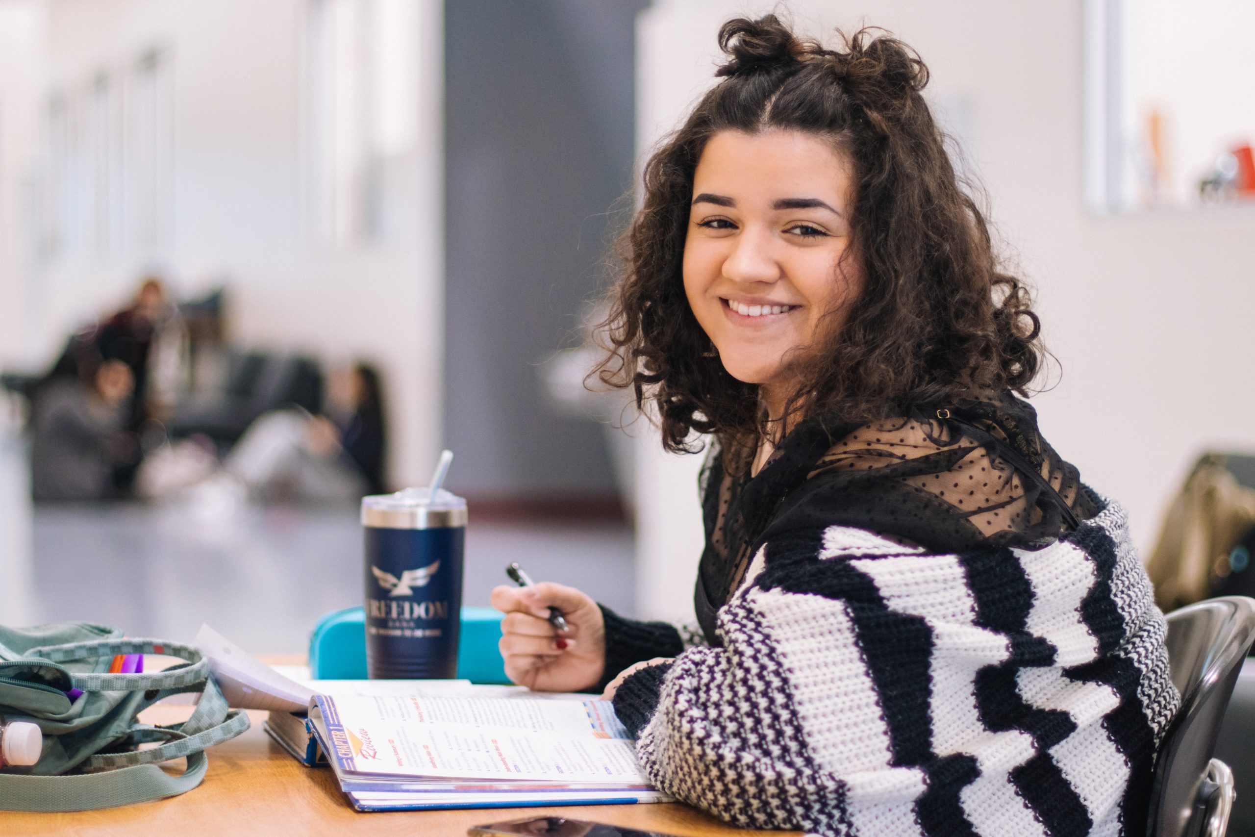 young woman student at a desk