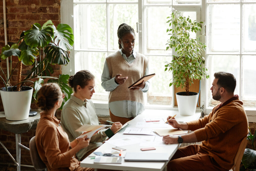 a diverse creative team discussing design project in modern studio