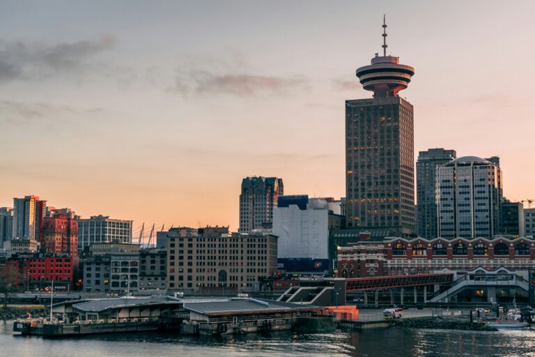 a photo of the Vancouver skyline with a pink sky